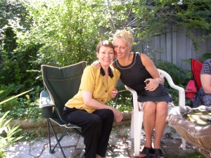 Picture of two female friends smiling together and sharing a moment of joy.