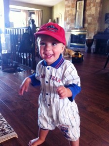 Baby Elliott toddling with his ball cap. humor, kids' humor, children's humor