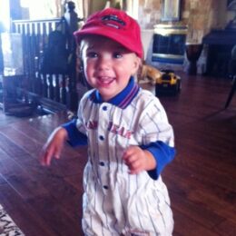 Baby Elliott toddling with his ball cap. humor, kids