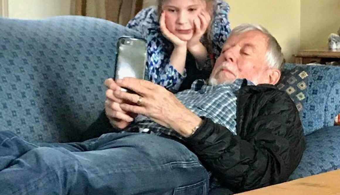 grandparent and girl on iphone
