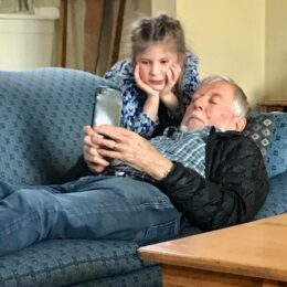 grandparent and girl on iphone