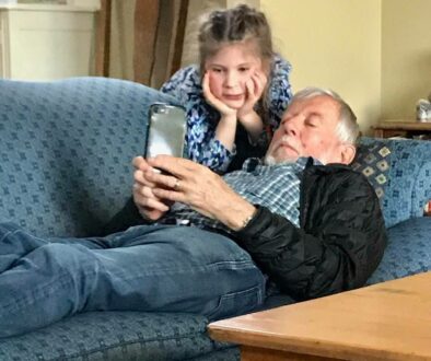 grandparent and girl on iphone