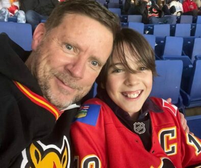 Son and dad at a Flames hockey game