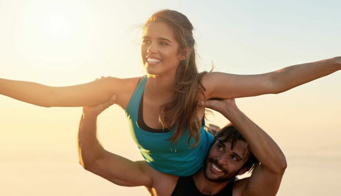 man uplifting a woman