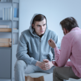 two men listening in man therapy