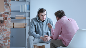 two men listening in man therapy